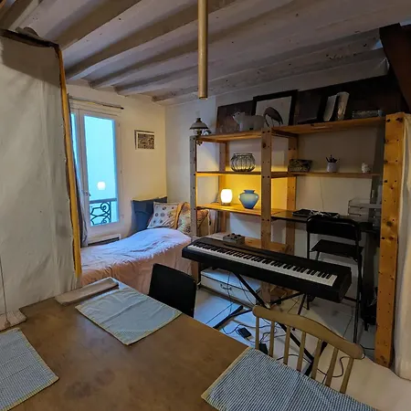 Апартаменты Loft Authentique Et Boheme - Montorgueil
